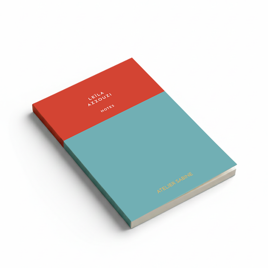 Notebook with red and blue cover on a white background